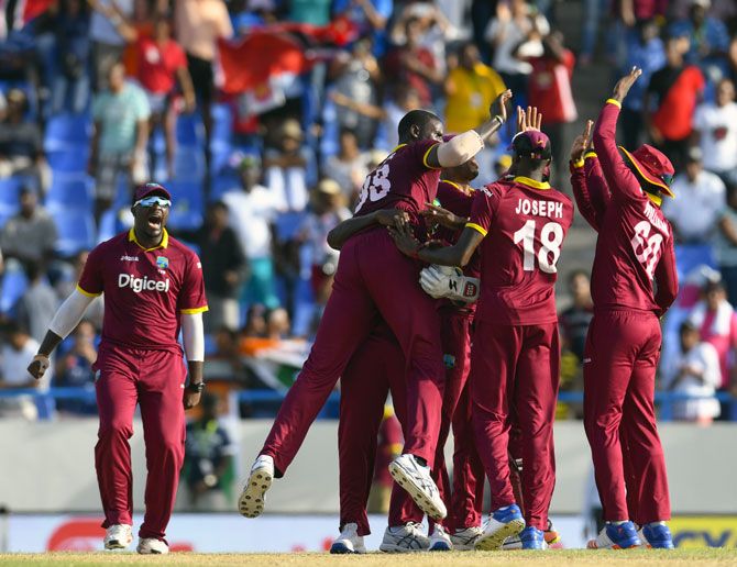West Indies celebrate winning the fourth ODI against India