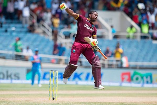 West Indies opener Evin Lewis celebrates on completing his century against India during the lone T20 at Kingston, Jamaica, on Sunday