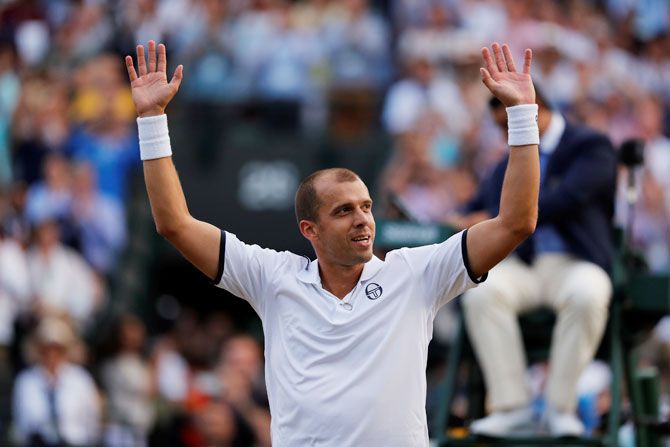 Luxembourg’s Gilles Muller celebrates winning the Wimbledon fourth round match against Spain’s Rafael Nadal in London on Monday