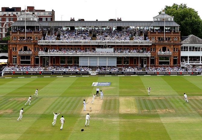  England's players celebrate a wicket during the first Test match against South Africa at Lord's on July 9, 2017