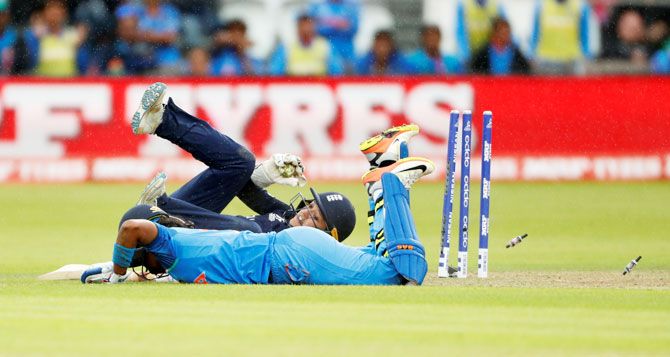England's Sarah Taylor runs out India's Shikha Pandey