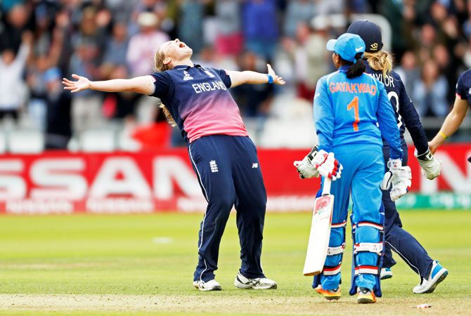 England's Anya Shrubsole celebrates bowling out India's Rajeshwari Gayakwad to win the World Cup