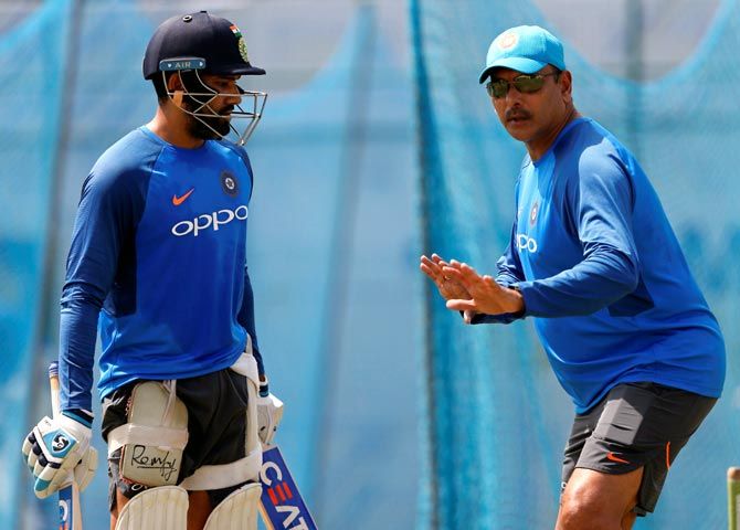 Head Coach Ravi Shastri gives Rohit Sharma some pointers at the nets session in Galle on Tuesday
