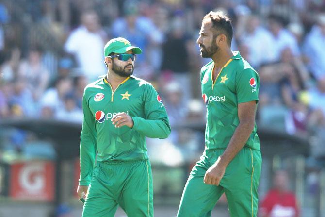 Pakistan's Azhar Ali with bowler Wahab Riaz