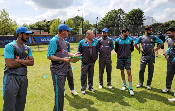 Pakistan coach Mickey Arthur speaks to his players prior to a training session