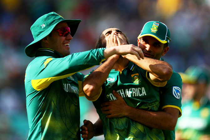 South Africa's Imran Tahir (centre) celebrates the wicket of Sri Lanka's Asela Gunaratne during their ICC Champions Trophy match at The Oval in London on Saturday