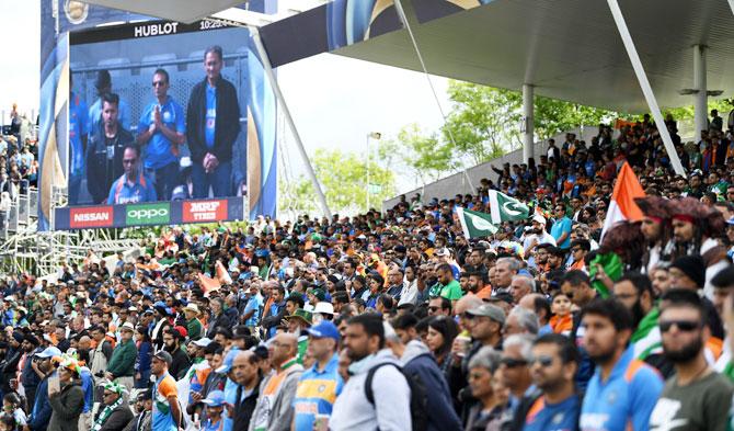 Players and fans observe a minute's silence in memory of the victims of Saturday night's terror attack in London ahead of the match between India and Pakistan