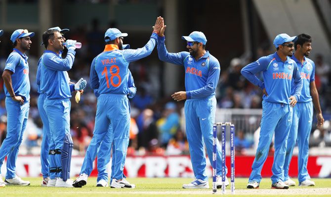 India players celebrate the wicket of South Africa's Andile Phehlukwayo