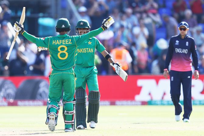 Pakistan batsmen Mohammad Hafeez and Babar Azam celebrate on scoring the winning runs to defeat England in the Champions Trophy semi-final at Sophia Gardens in Cardiff on Wednesday