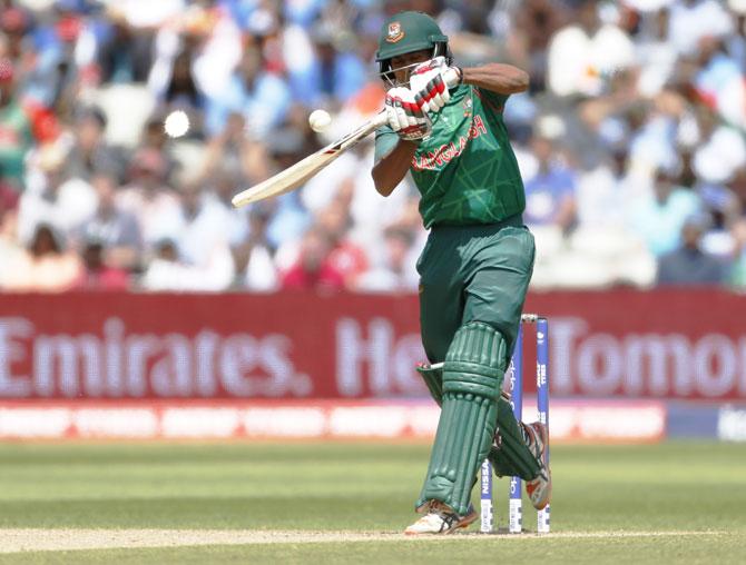 Mosaddek Hossain plays a shot only to be caught and bowled by India’s Jasprit Bumrah