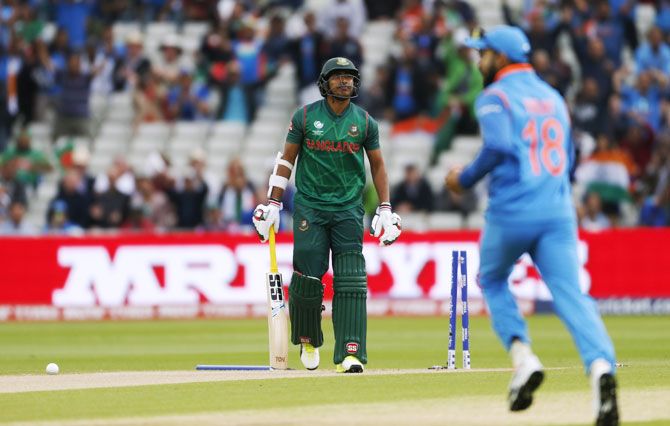 Bangladesh’s Soumya Sarkar reacts after losing his wicket to India's Bhuvneshwar Kumar