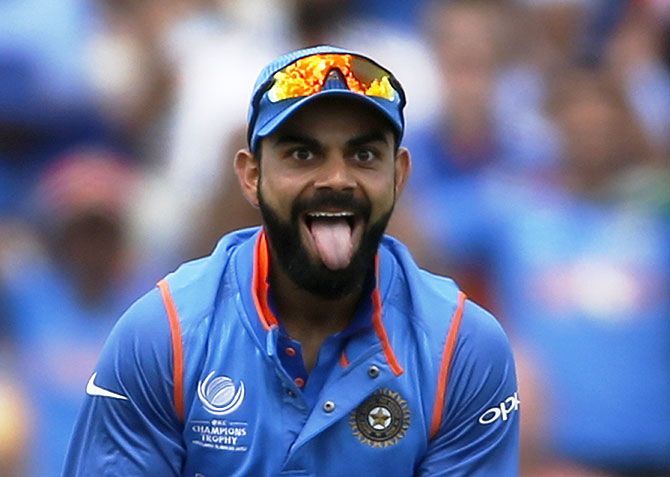 India captain Virat Kohli celebrates after taking a catch to dismiss Bangladesh’s Mushfiqur Rahim 