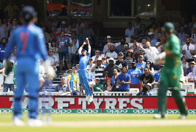 India's Hardik Pandya leaps as he attempts a catch at the boundary