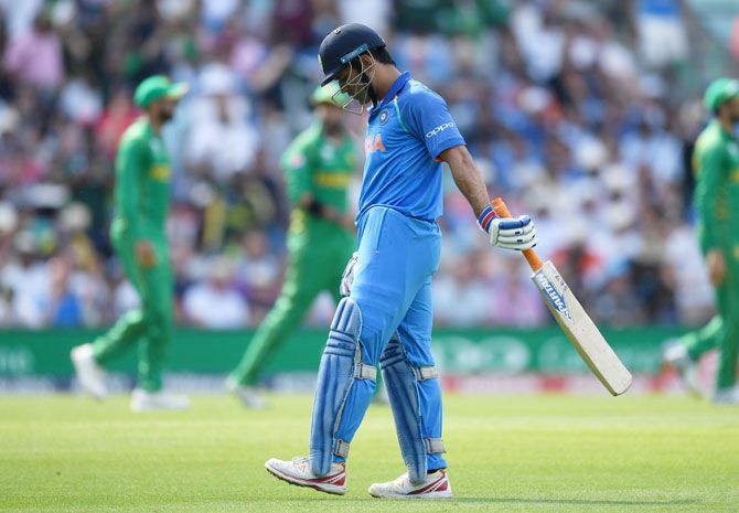 MS Dhoni leaves the field after being caught out by Imad Wasim