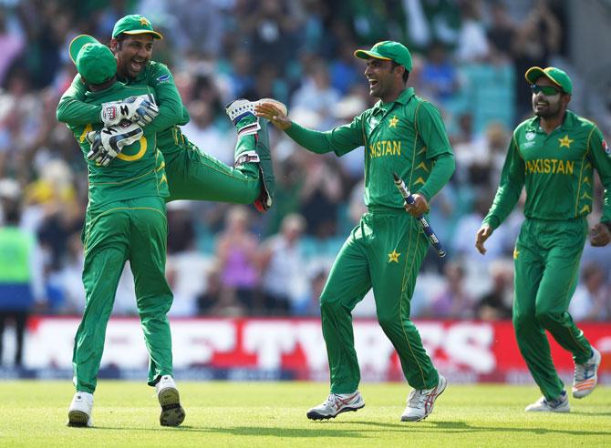 Pakistan captain Sarfraz Ahmed celebrates with Shoaib Malik after winning the ICC Champions Trophy final against India at The Kia Oval in London on Sunday