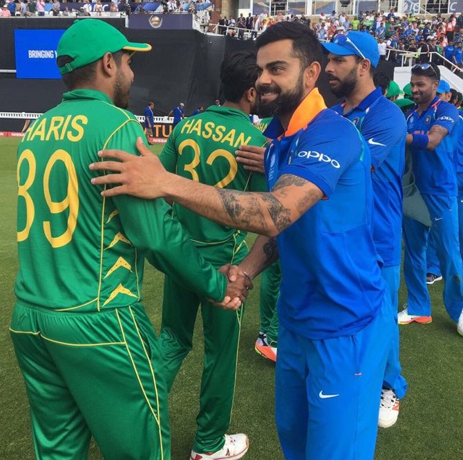The Indian team congratulates the winning Pakistan team after the Champions Trophy final, June 18, 2017
