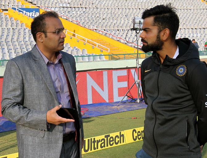 Virender Sehwag with India captain Virat Kohli