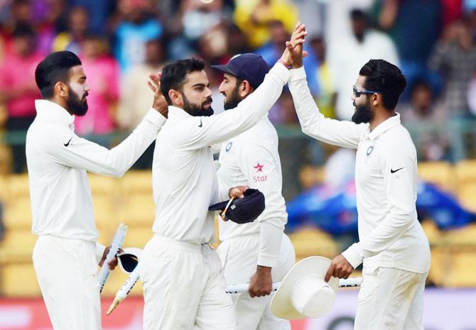 India players celebrate their victory in the 2nd Test against Australia in Bengaluru on Tuesday