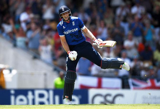 England's Joe Root celebrates reaching his century against West Indies during the 3rd One Day International at Kensington Oval in Bridgetown, Barbados, on Thursday