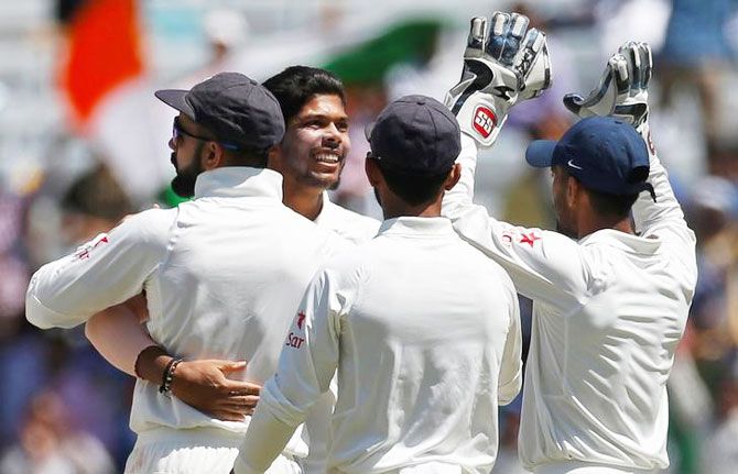 India's Umesh Yadav (centre) celebrates the dismissal of Australia's Matt Renshaw on Thursday