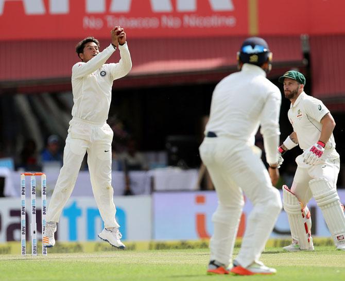 Kuldeep Yadav takes the catch to dismiss Pat Cummins