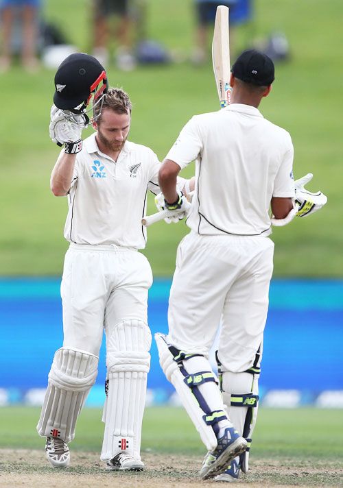 New Zealand captain Kane Williamson is congratulated by teammate Jeet Raval on completing his century on Day 3 of the 3rd Test at Seddon Park in Hamilton, New Zealand, on Monday