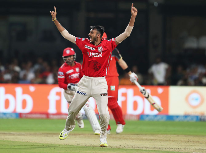 Axar Patel celebrates the wicket of Shane Watson 