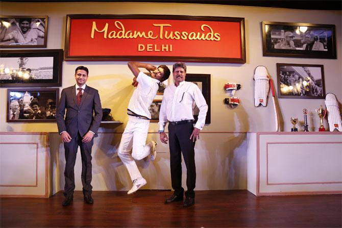 Kapil Dev (right) strikes a pose beside his wax figurine in New Delhi on Thursday