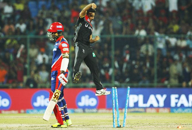 RCB's Harshal Patel celebrates after dismissing Delhi's Marlon Samuels