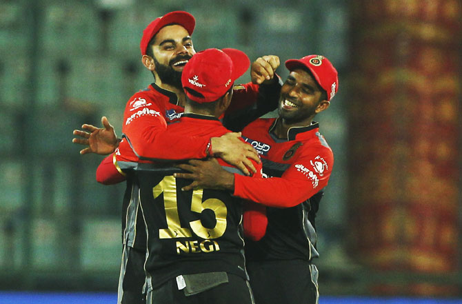 Royal Challengers Bangalore captain Virat Kohli celebrates after defeating Delhi Daredevils at the Feroz Shah Kotla Stadium in New Delhi on Sunday