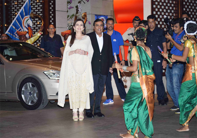 Nita and Mukesh Ambani are welcomed by 'Lezhim' dancers and musicians