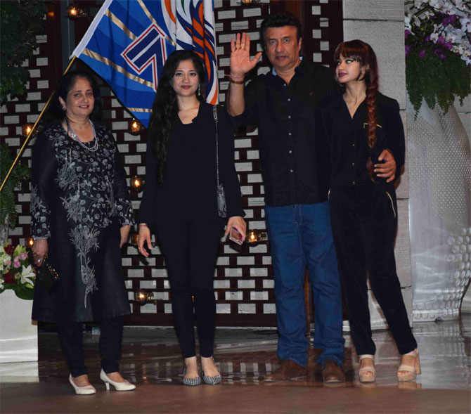 Bollywood music composer Anu Malik and his family arrive for the party