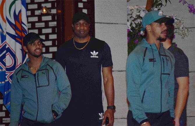 Mumbai Indians' Carribean players Nicholas Pooran, Kieron Pollard, and Lendl Simmons look set for the party