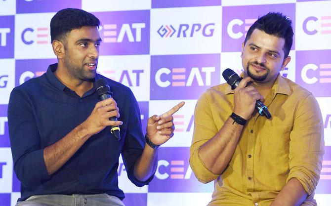 Indian cricketers R Ashwin and Suresh Raina speak during the CEAT Cricket Awards in Mumbai on Wednesday