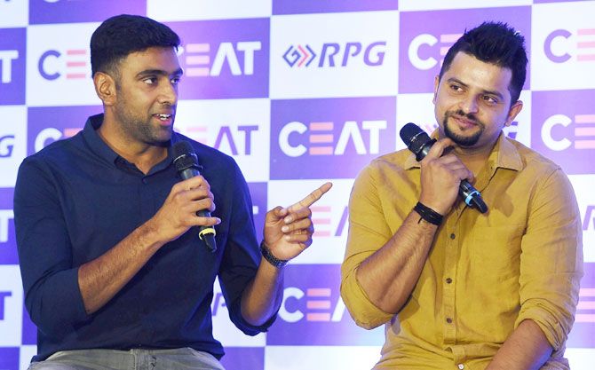 Indian cricketers R Ashwin and Suresh Raina speak during the CEAT Cricket Awards in Mumbai on Wednesday