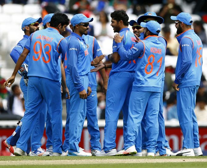  India's players celebrate a wicket in the warm-up game against Bangladesh