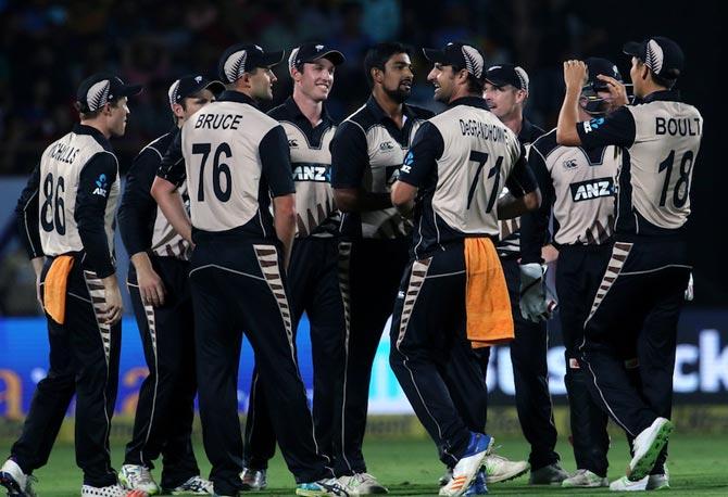 New Zealand’s players celebrate the dismissal of Hardik Pandya