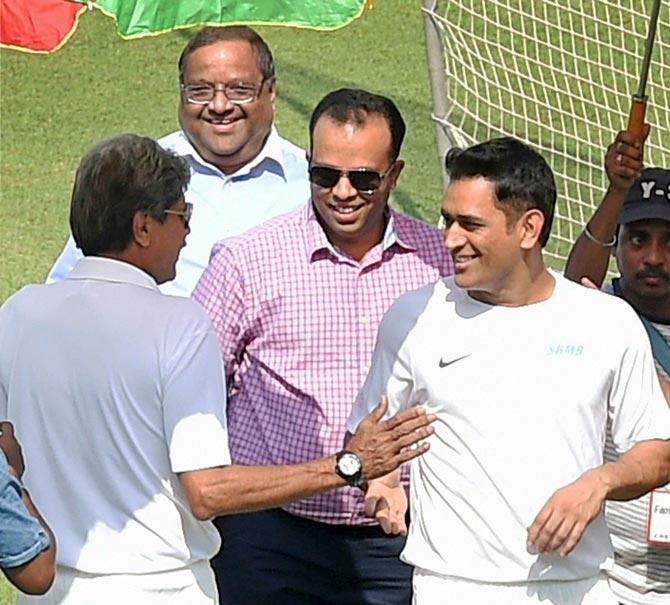 Mahendra Singh Dhoni with Kapil Dev during an ad shoot at the Eden Gardens in Kolkata on Thursday