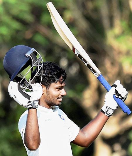 Board President's XI's Sanju Samson celebrates on completing his century against Sri Lanka during the warm-up match in Kolkata on Sunday