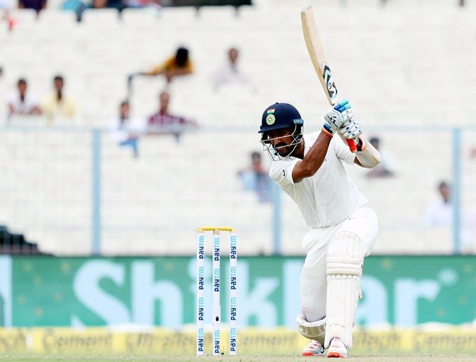 Cheteshwar Pujara scored a gutsy unbeaten 47 before rain stopped play on Day 2