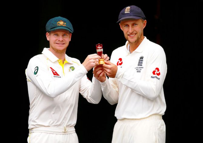 Australia captain Steve Smith and his English counterpart Joe Root with the urn at the Gabba in Brisbane on Wednesday