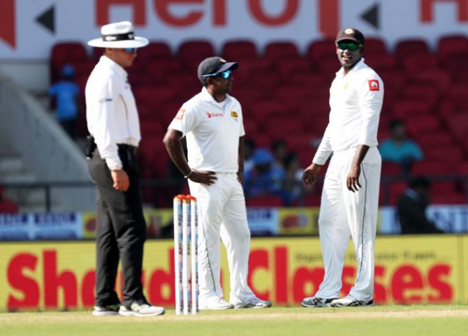 Sri Lanka's Rangana Herath and Angelo Mathews on Day 3 of the 2nd Test against India at the Vidarbha Cricket Association Stadium in Nagpur on Sunday