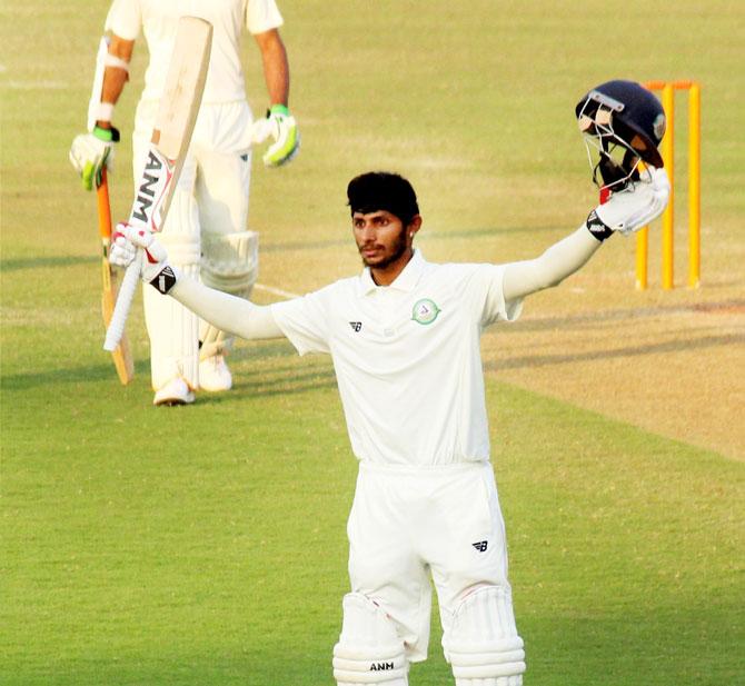 Vidarbha batsman Ramaswamy Sanjay celebrates his century during the Ranji Trophy match against Himachal in Nagpur, on Sunday