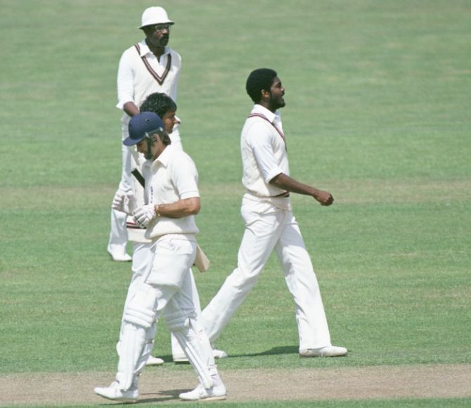 In this file photo, Michael Holding (right) and Clive Lloyd celebrate the wicket of England's Peter Willey
