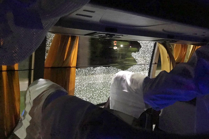 The window glass of Australia's team bus is shattered 