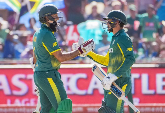 South Africa's Hashim Amla (left) congratulates teammate Quinton de Kock on his 50 runs during the 1st ODI against Bangladesh at Diamond Oval in Kimberley on Sunday
