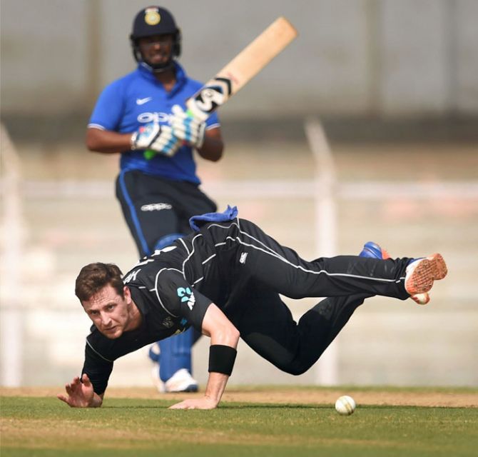 New Zealand's Henry Nicholls dives for to field the ball during the 2nd practice match against Indian Board President's XI in Mumbai on Thursday