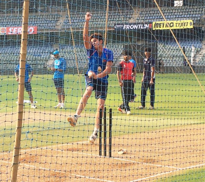 Sachin Tendulkar's son, Arjun, bowls in the nets during India's practice session in Mumbai on Friday