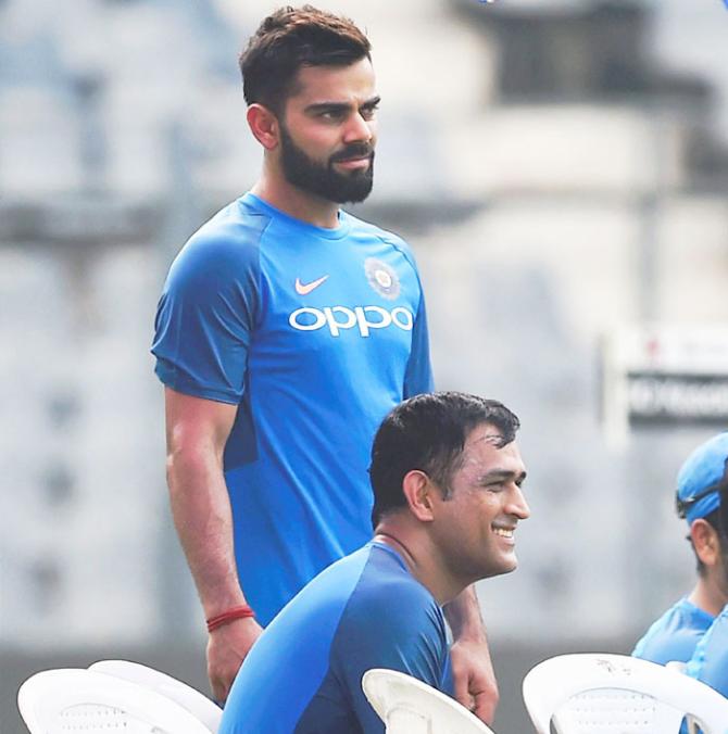 Virat Kohli and MS Dhoni before hitting the straps at a practice session