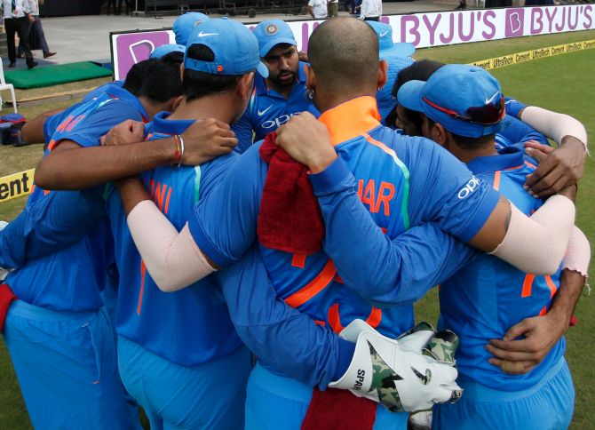 Team India in a huddle